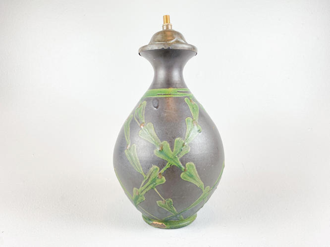 Earthenware vase decorated with cow horn glaze. Later mounted as a table lamp, not drilled out. Signed at the bottom. Total height 25/30 cm.